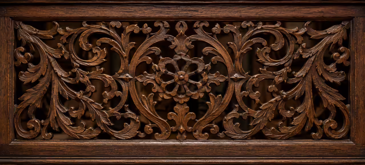 Decorative pierced fretwork panel featuring Victorian floral ornament, layered carving, and intricate openwork patterns.