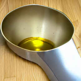 Applying linseed oil to leather boots step 2