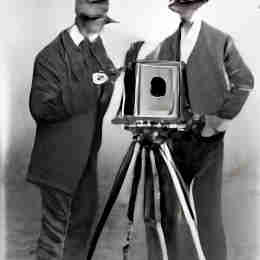 AI generated photographers looking at a box camera